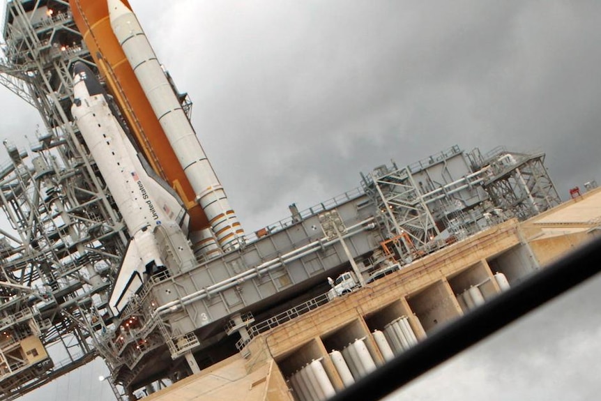 Storm clouds threaten final shuttle launch