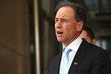 Health Minister Greg Hunt speaking at a press conference
