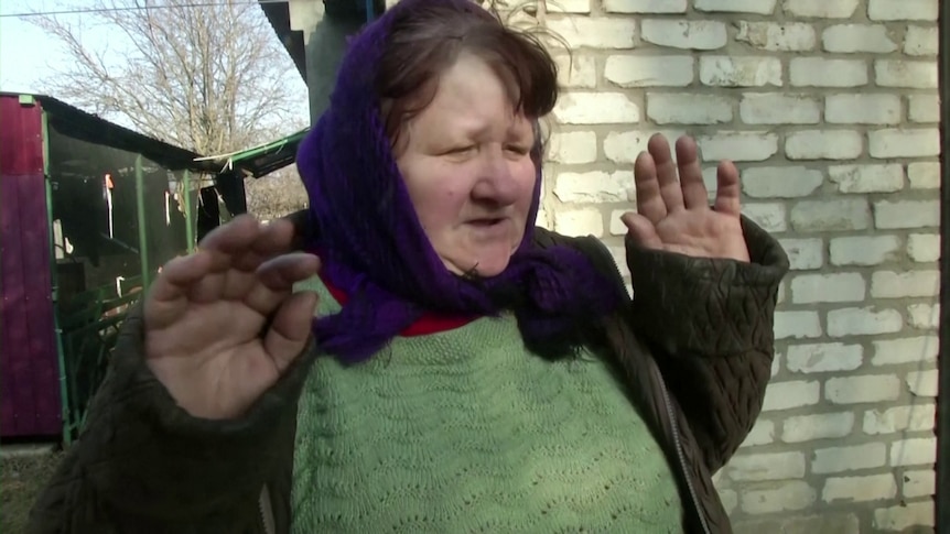 A Ukrainian woman speaks during an interview.