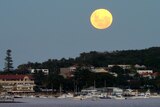 The 'supermoon' rises over Watsons Bay.