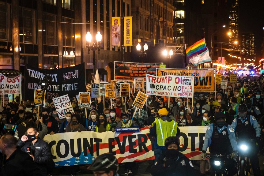 Hundreds of protesters march against Donald Trump through the Loop in Chicago