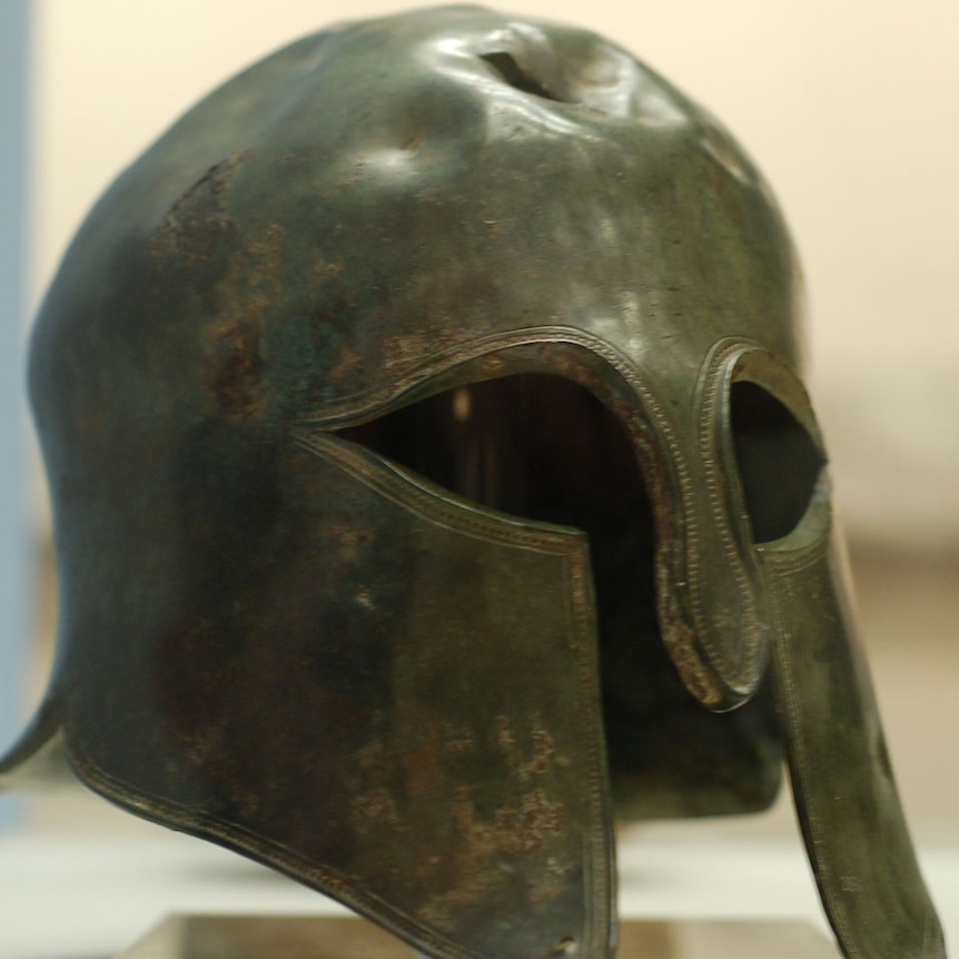 A metal helmet with one continuous opening for the eyes and mouth.