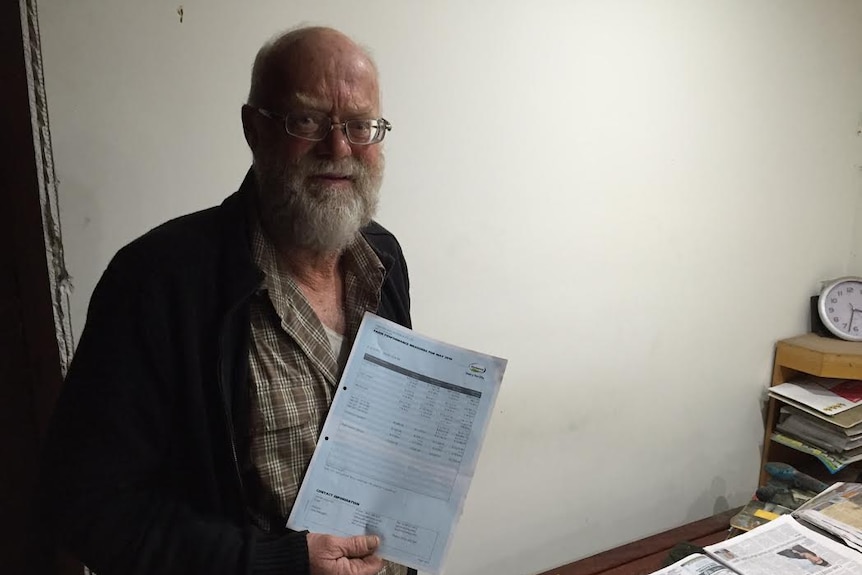 Clive Orgill holds up his May financial statement from Fonterra.