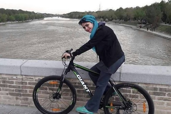 Iranian woman rides her bike despite ban