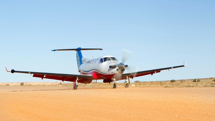 Royal Flying Doctor Service Plane on dirt runway in outback Australia