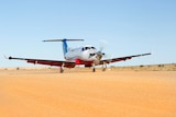 Royal Flying Doctor Service Plane on dirt runway in outback Australia