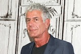 Anthony Bourdain is seen posing for a photo.