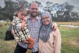 Joseph Hartley, with daughter Keisha and wife Hawa at their Tasmanian rice crop, February 2020.