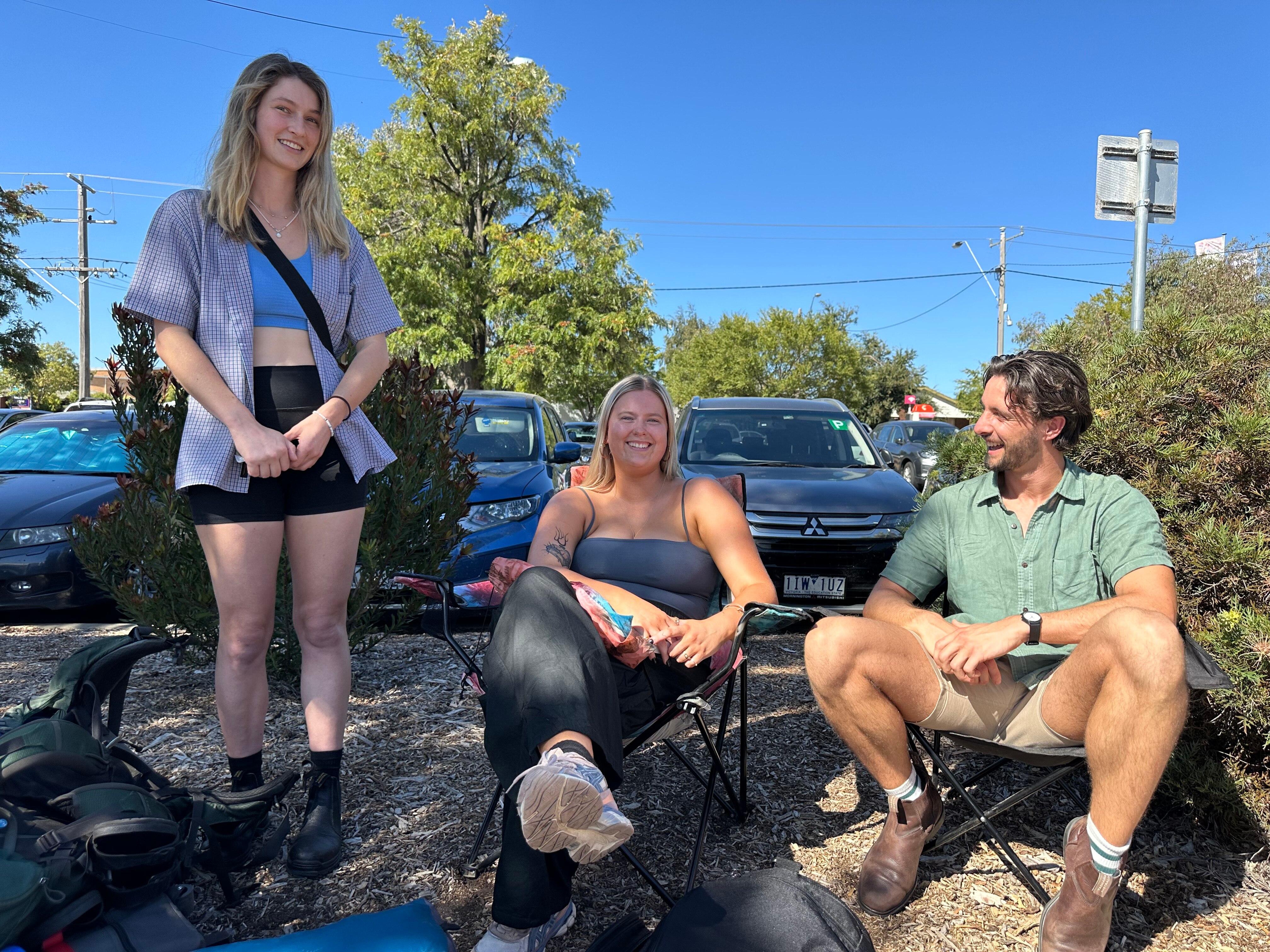 Three young people outside in hot weather