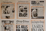 Newspaper clippings of Osama bin Laden's death are posted on a wall inside a staff office at the White House.