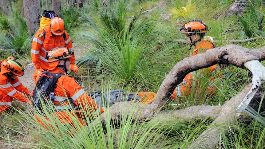 Rockhampton SES volunteers gathered in bushland during a training exercise