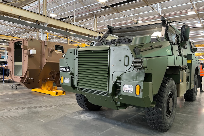 a photo of a bushmaster vehicle in a workshop 