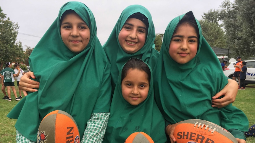 (L-R) Shamsia Barakzai, Tahira Roshan, Zahra Roshan and (front) Amina Barakzai have embraced the chance to learn football