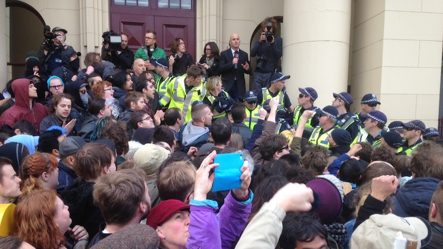 Police stand between opposing multiculturalism rallies in Richmond.