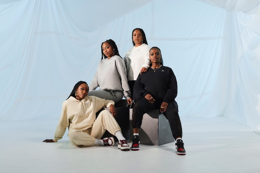 Four black women in activewear, styled