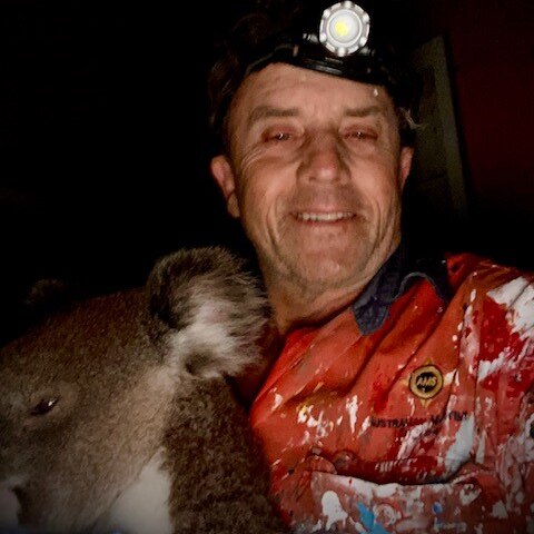 A man and a koala.