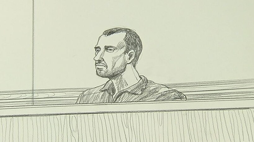 A court sketch of man sitting, wearing a shirt, with a beard and receding hairline.