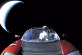 Elon Musk's Tesla Roadster enroute to Mars orbit and then the Asteroid Belt.