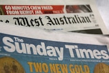The mastheads for The Sunday Times and The West Australian newspapers lay on a table.
