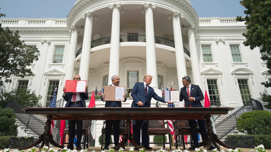 Donald Trump overseas diplomats from Israel, Bahrain and UAE signing an agreement in front of the White House.