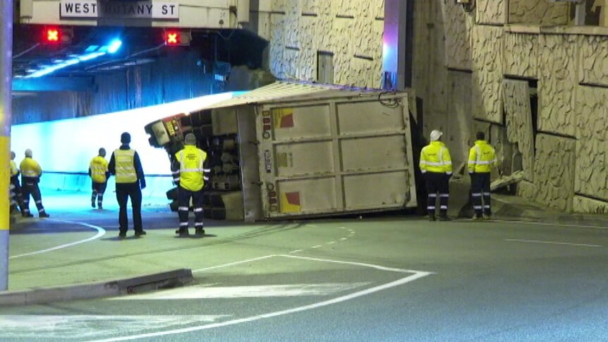 truck tipped over in front of motorway tunnel entrance