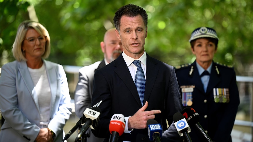 NSW Premier Chris Minns stands at press conference with Police Minister Yasmin Catley and NSW Police Commissioner Karen Webb