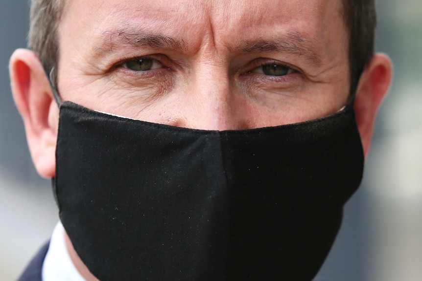 A close up of WA Premier Mark McGowan wearing a mask.