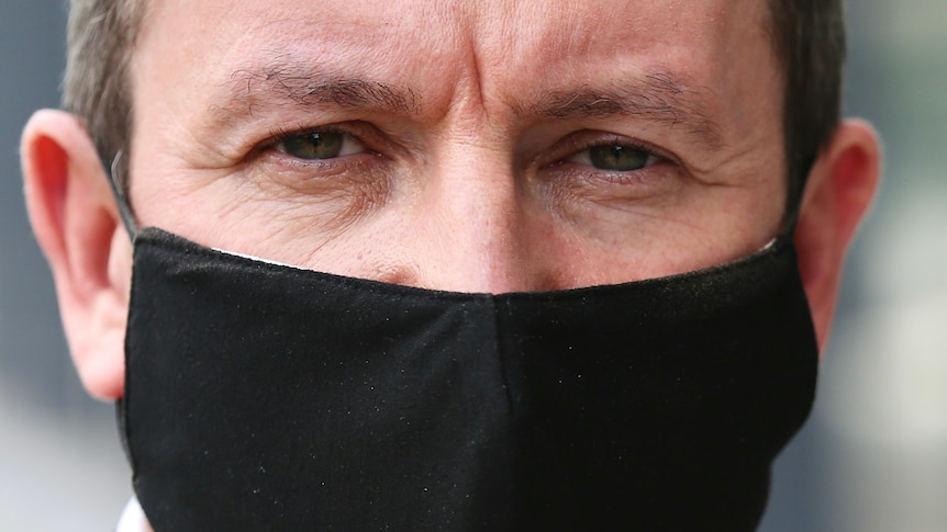 A close up of WA Premier Mark McGowan wearing a mask.