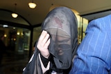 Fatima Elomar, whose husband, an Islamic State fighter, is believed to have died in Syria arrives in court.