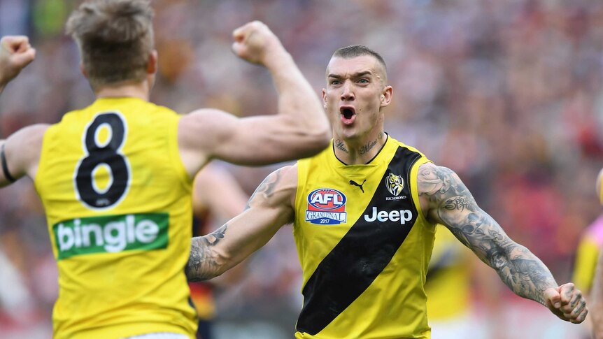 Dustin Martin and Jack Riewoldt cheer after a goal is kicked.