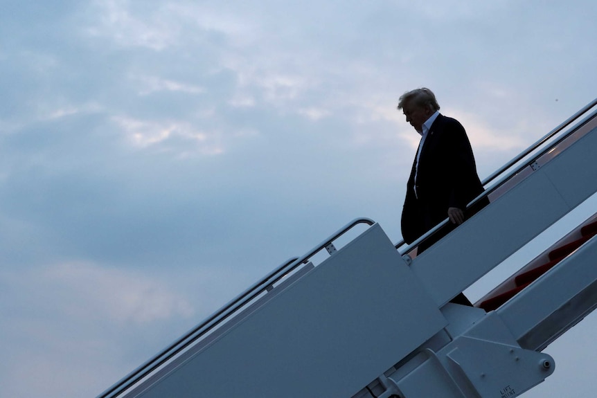 US President Donald Trump arrives aboard Air Force One from Singapore.