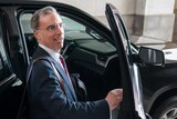 White House counsel Pat Cipollone gets into a car to leave.