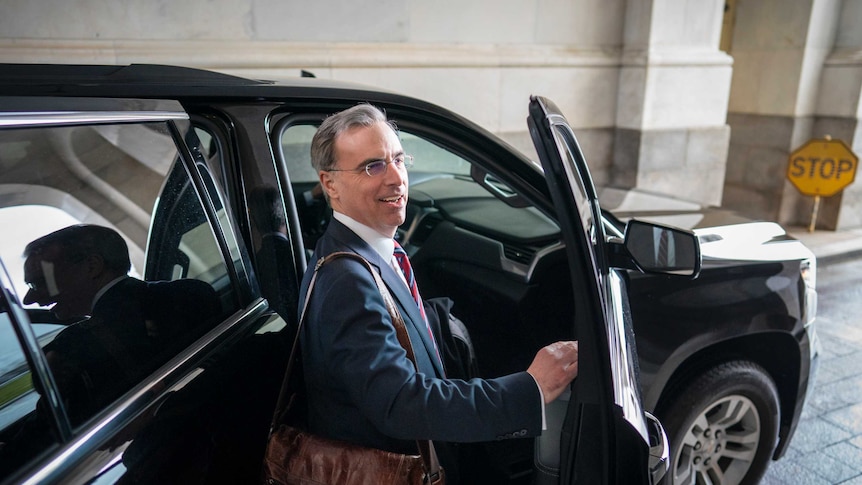 White House counsel Pat Cipollone gets into a car to leave.