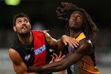 Essendon's Patrick Ryder and West Coast's Nic Naitanui contest the ruck at Subiaco Oval.