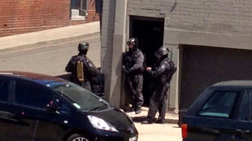 Armed police outside a building in Leichhardt