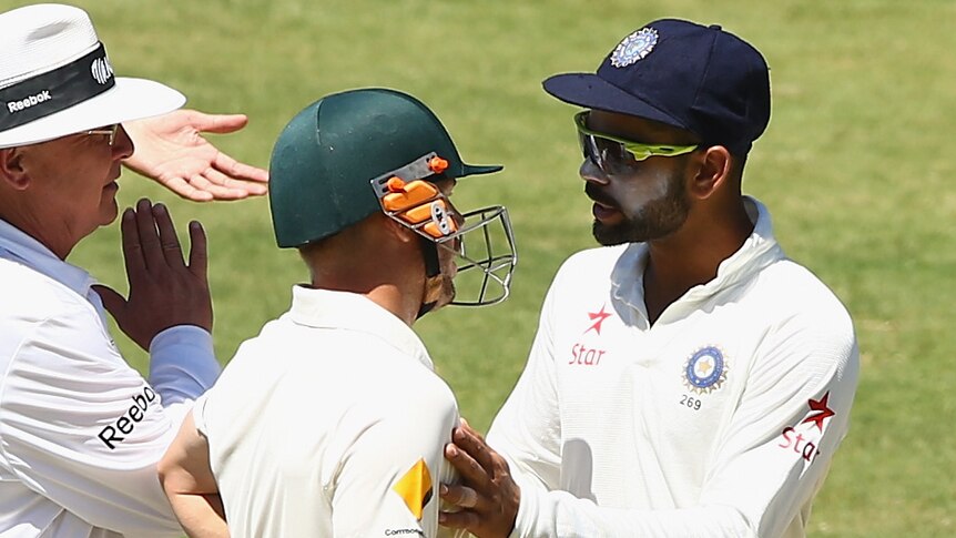 Virat Kohli of India and David Warner of Australia arguing