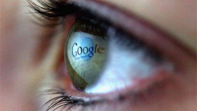 Google logo reflected in a person's eye