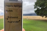 A phone with the weather radar open in a storm