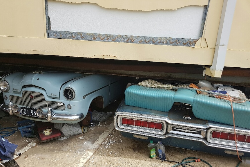 A 1965 Ford Thunderbird and a 1955 Ford MK1 Zephyr crushed under Ivan Warden's house