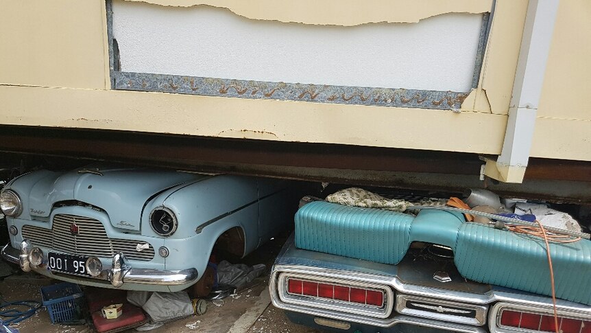 A 1965 Ford Thunderbird and a 1955 Ford MK1 Zephyr crushed under Ivan Warden's house