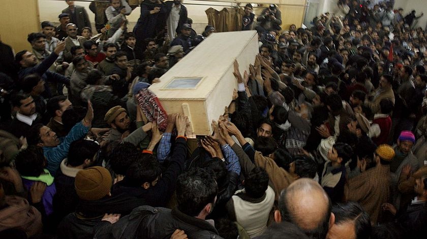 The coffin of Benazir Bhutto is carried out of Rawalpindi General Hospital.