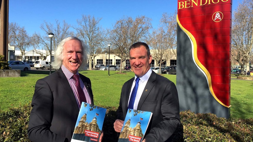 Bendigo's Mayor Rod Fyffe and the Chief Executive Craig Niemann pose with copies of the city's independent review report.