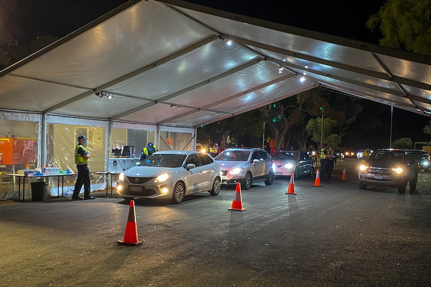 Cars at a border checkpoint.