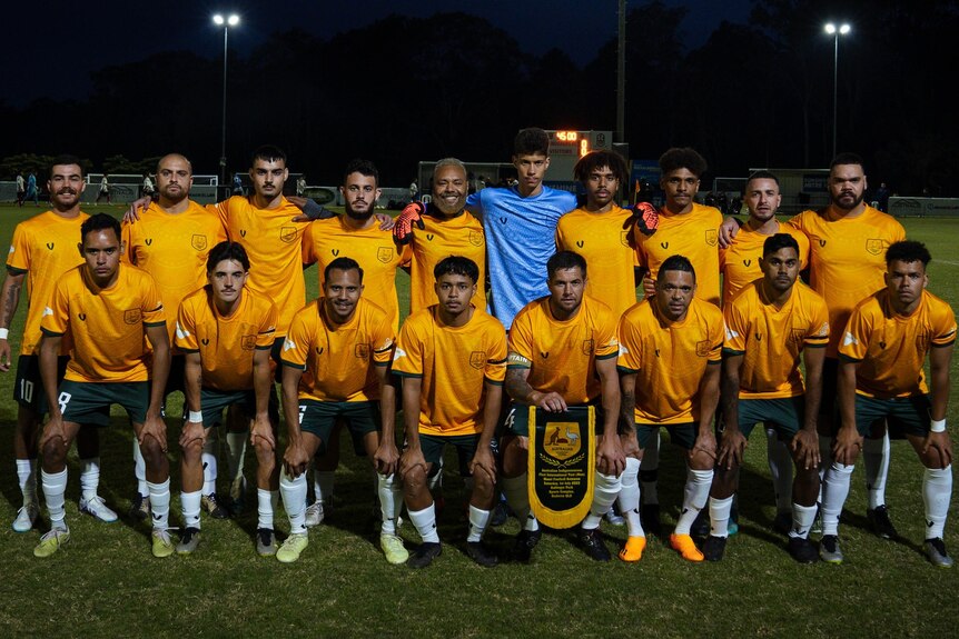 Australian soccer players wear their green and gold uniforms