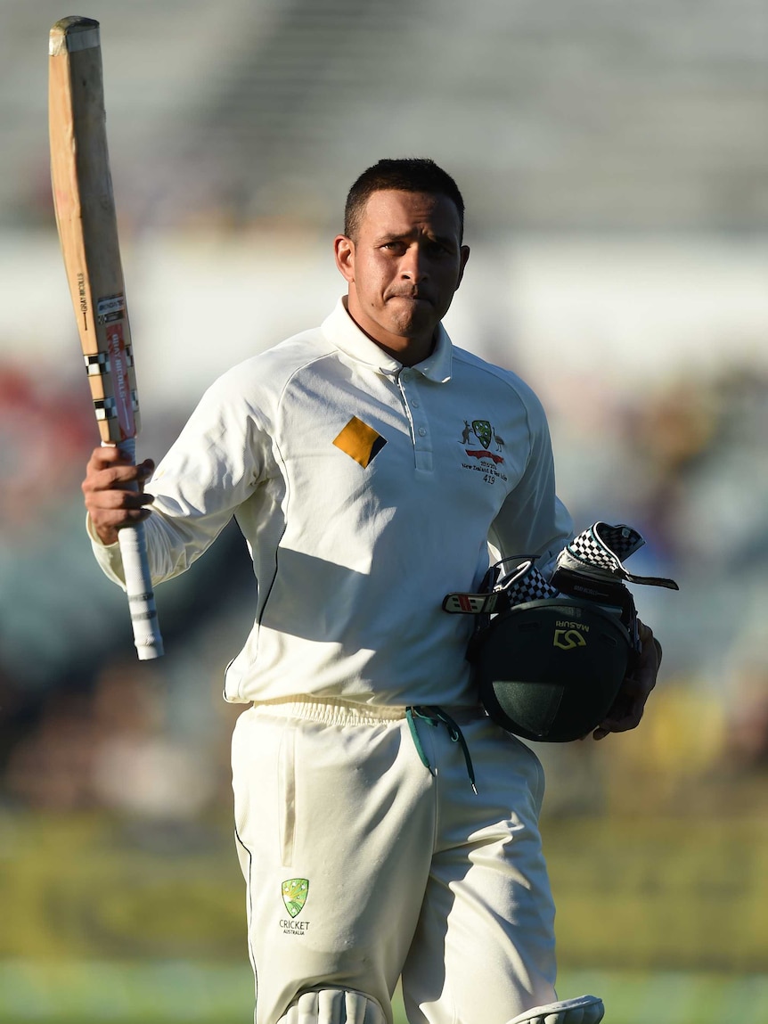 Usman Khawaja walks off after being dismissed on day one at the WACA