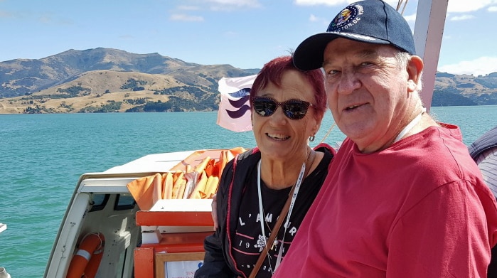 Ursula Steinberner and Leon Sharp sit on the deck of a boat.