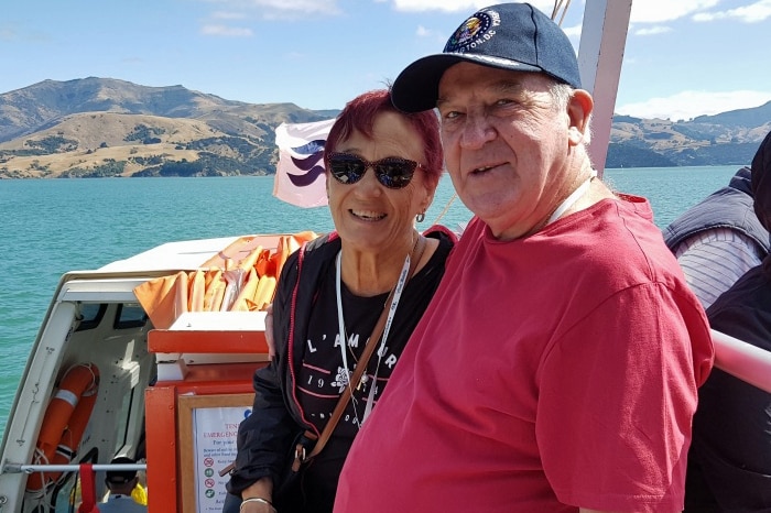 Ursula Steinberner and Leon Sharp sit on the deck of a boat.