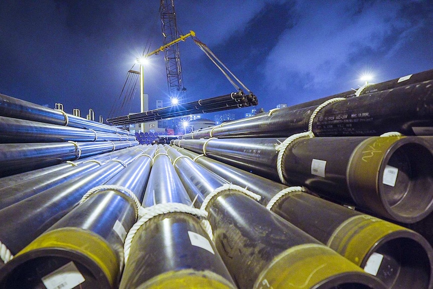 huge pipelines stockpiled on top of each other