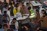 Pakistani volunteers help blast victims