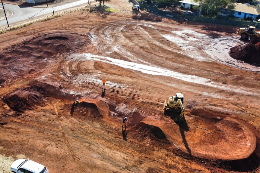 an aerial shot of a BMX track being built on a vacant block